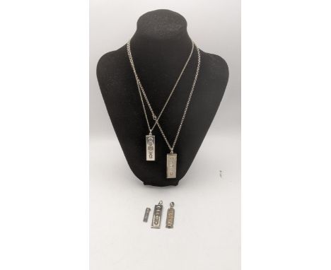 4 silver ingot pendants two on silver necklaces together with a white metal Egyptian Cartouche total weight 79.9gLocation:If 