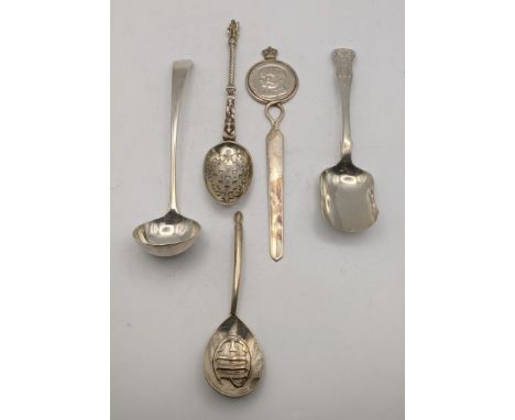 Silver utensils to include a sauce ladle, sugar scoop, sugar sifter and one other together with a letter opener, total weight