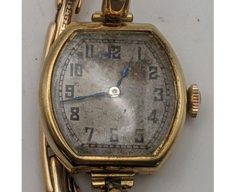 An 18ct gold ladies manual wind wrist watch on a 15ct gold expanding strap total weight 17.2gLocationIf there is no condition