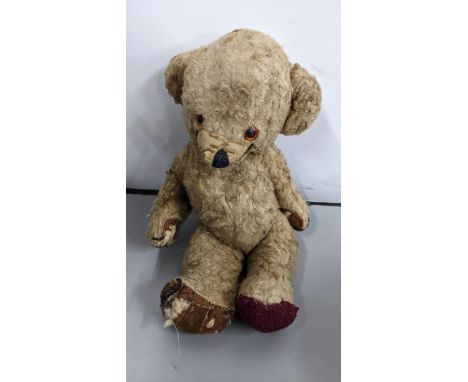 A vintage 1960s/70s Merrythought made soft toy Cheeky Teddy bear, golden mohair with bells in ears, orange and black plastic 
