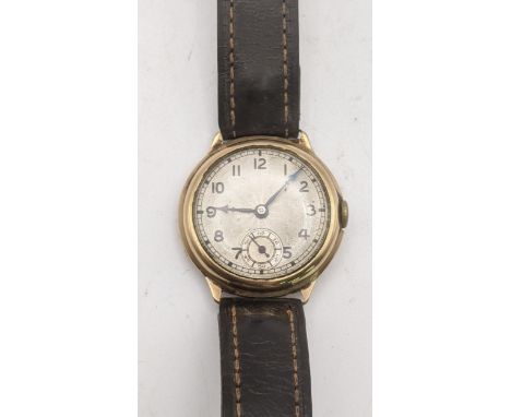 A gents 9ct gold manual wind wrist watch on a brown leather strap Location:If there is no condition report shown, please requ
