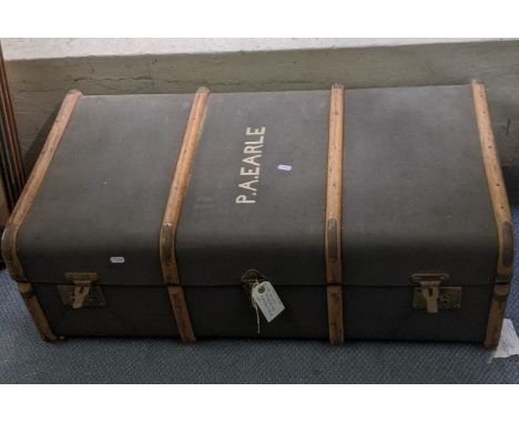 An early 20th century canvas bound trunk with bentwood supports, inscribed to the lid PA Earle 90cmw x 51cm deep, 32cm highLo