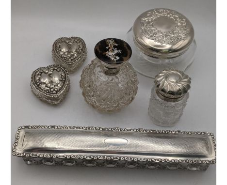 Silver and glass dressing table items to include 4 crystal cut glass and silver topped jars, three having embossed lids along