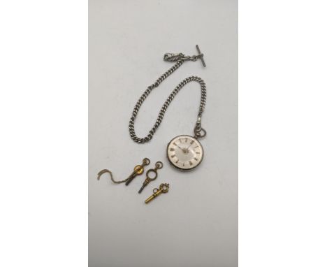 A Victorian open faced ladies pocket watch on a silver pocket watch on a silver pocket watch chain having tow bulldog clips a