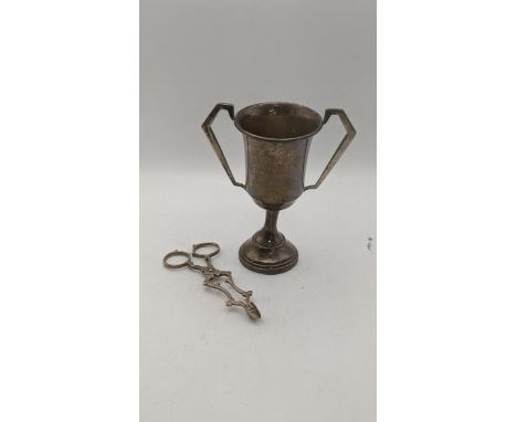 Silver to include a twin handled cup, hallmarked London 1937, together with a pair sugar tongs, total weight 122.2gLocation:I