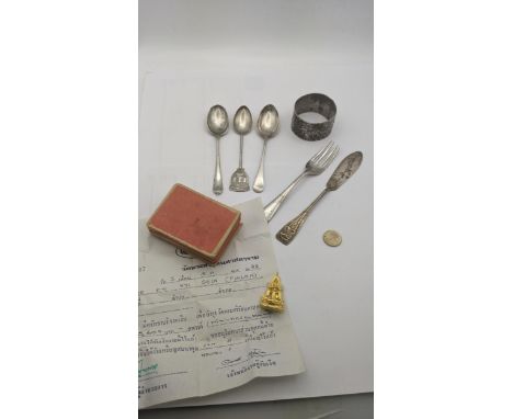 Mixed silver to include a floral engraved napkin ring, three tea spoons and others total weight 110.9g along with a Indian go