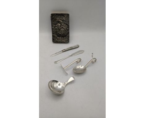 Silver to include an Edwin Joseph Houlston christening spoon and pusher, a common prayer book, a silver and mother of pearl f