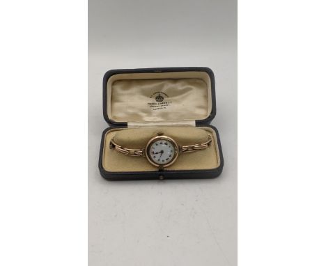 A 9ct gold ladies manual wind wrist watch on a 9ct gold expanding bracelet total weight 18.8g in a fitted caseLocation:If the
