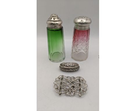 Silver to include nurse buckle, a embossed trinket having a gilt interior and two silver topped sugar castersLocation:If ther
