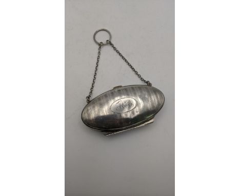 A silver purse with engraved initials and chain, hallmarked Birmingham 1916Location:If there is no condition report shown, pl