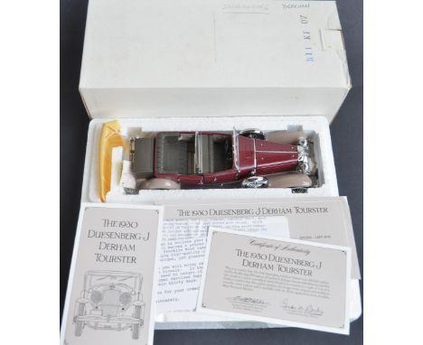 Three boxed 1/24 scale diecast car models from Franklin Mint, all with damage and/or missing parts to include a 1930 Duesenbe