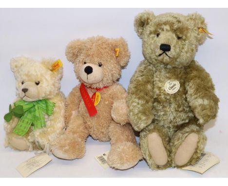 Three Steiff teddy bears: 1920 replica Classic, Good Luck bear with green ribbon, and one other, max. H32cm 