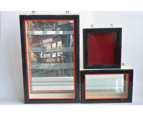 Three wall hanging front opening wood and glass display cabinets to include 2 multi-shelf examples suitable for displaying mo