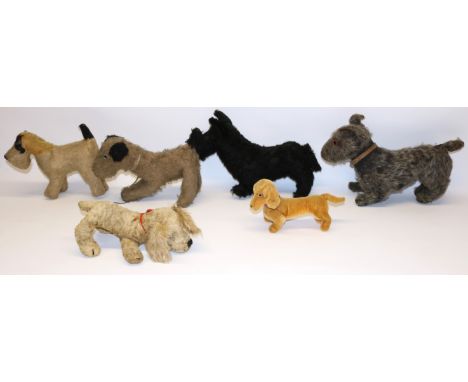 Five vintage toy dogs including a Chiltern golden spaniel, and a modern Steiff dachshund