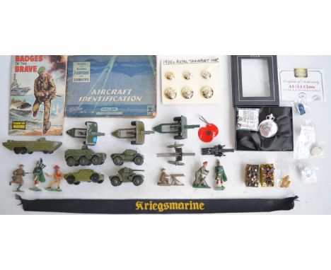 Collection of vintage military vehicles, artillery pieces and figures from Dinky and Britain's, Badges Of The Brave booksby D