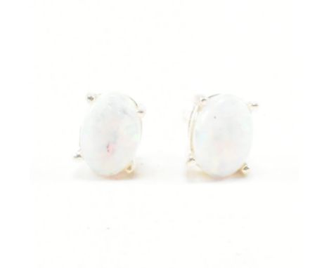 A pair of 925 silver and synthetic opal earrings. Measures 5mm each. Total weight approx 1.1g.&nbsp;All weights, measurements