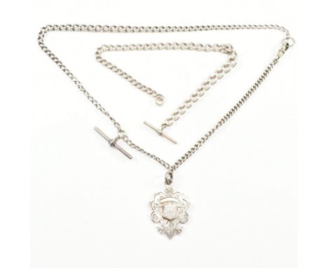 Two early 20th century watch chains to include. An Albert chain strung with a hallmarked silver medal, hallmarked for Birming