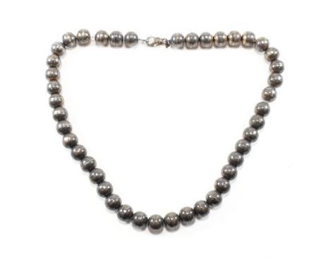 A vintage hallmarked silver beaded chain necklace. The necklace comprised of spherical seamed beads on an oval cable link cha