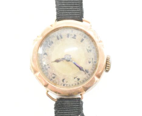 An antique hallmarked 9ct gold wristwatch. The watch having a circular dial with black Arabic numeral indies and blued hands 