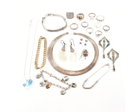 An assorted collection of silver and white metal jewellery. The lot to include a 9ct gold and silver eternity ring, multi str