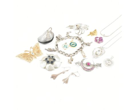 A collection of silver white metal and costume jewellery. The jewellery to include A white metal charm bracelet strung with d