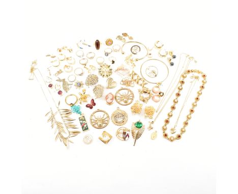 An assorted collection of gold tone costume jewellery. The lot to include 14ct gold filled, gold tone metal, bangles, white s