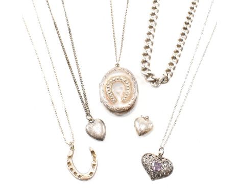 A collection of silver and white metal pendant necklaces and a watch chain. The pendant necklaces to include a Victorian ridi