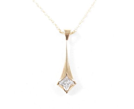 A hallmarked 9ct yellow gold and white stone pendant on necklace chain. The pendant having a square cut white stone to granul