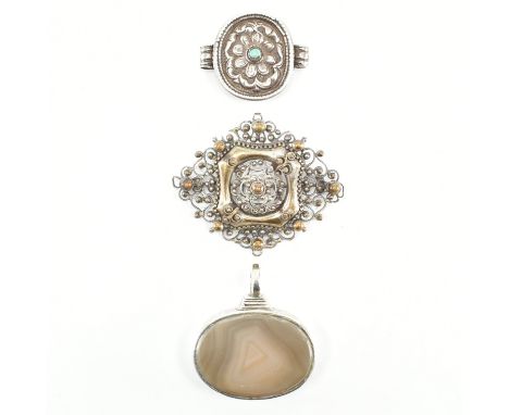 A silver and agate pedant and turquoise set slide. The pendant having chased decoration depicting fish, birds and lizards. We