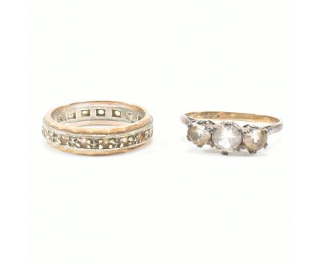 Two 9ct gold &amp; white spinel set rings. The first ring of 9ct gold and silver having three graduating white stones to cath