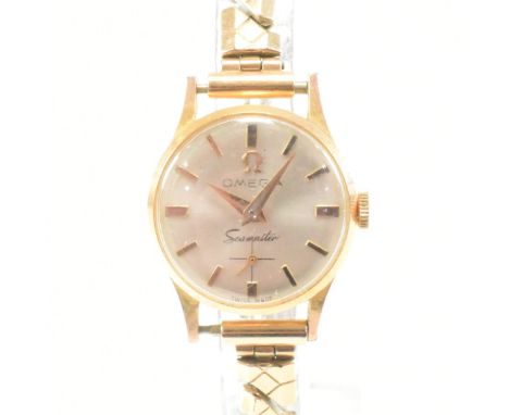 A vintage ladies Omega Seamaster gold plated watch. The watch having a cream dial with gold indices. Face measures approx 22m