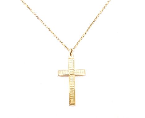 A hallmarked 9ct gold cross pendant and chain necklace. The cross having engine patterning throughout, hallmarked for Birming