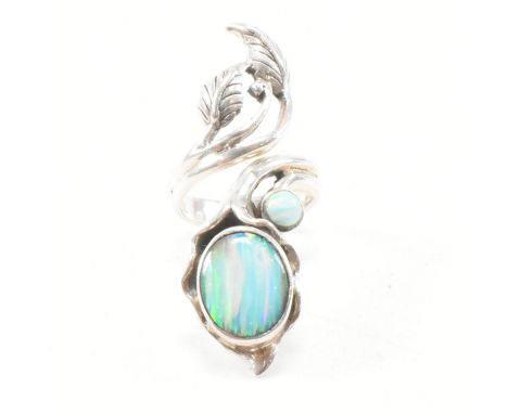 A 925 Art Nouveau style silver and synthetic opal ring. Weight 11.5g. Size H.5.&nbsp;All weights, measurements and sizes are 