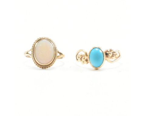 Two hallmarked 9ct gold gem set rings. A hallmarked opal ring set with a central bezel set opal cabochon with filigree decora