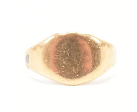 An antique hallmarked gold signet ring. The ring having a shield type head with rubbed monogrammed initials to a tapering sha