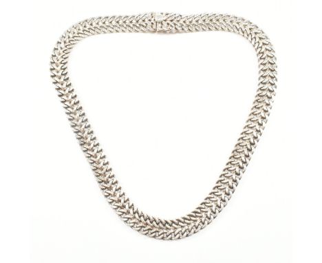 A hallmarked silver necklace chain. The chain comprised of two rows of uniform curb links united by a box clasp. Marked 925, 