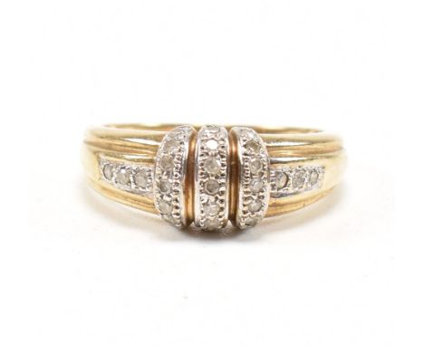 A hallmarked 9ct yellow gold and diamond cluster ring. The ring having a banded head set with diamonds and further round cut 