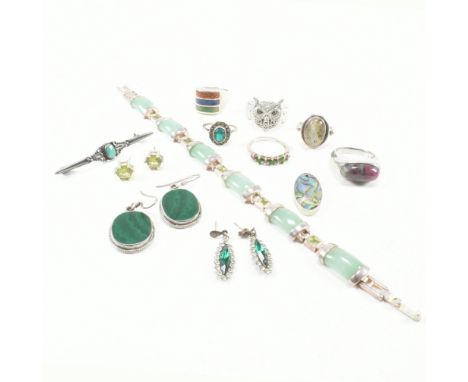 An assorted collection of silver and white metal jewellery. The lot to include jade, peridot, aventurine, anyolite / ruby in 
