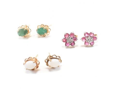 A collection of three pairs of 9ct gold gem set earrings. The earrings including ruby emerald and opal. Total weight 3.3g. La