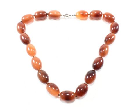 A vintage 925 silver and simulated amber beaded necklace. The necklace having statement oval mottled brown orange beds on kno