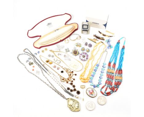 An assorted collection of vintage and later costume jewellery. The lot to include a Givenchy 1978 stick pin, gold and silver 