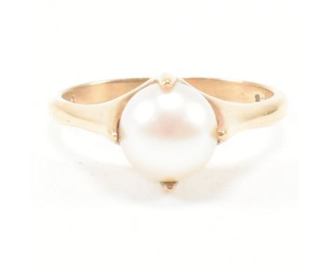 A vintage 9ct yellow gold and pearl solitaire ring. The single stone dress ring having a round white cultured pearl set with 