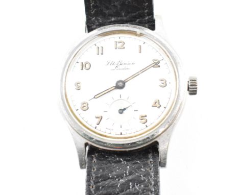 A vintage J. W. Benson London wristwatch. The watch having a circular silvered dial with radium Arabic numeral indices, syrin