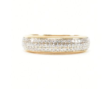 A 14ct gold and diamond half eternity ring. The ring having pave set round brilliant cut diamonds to plain tapering band. Mar