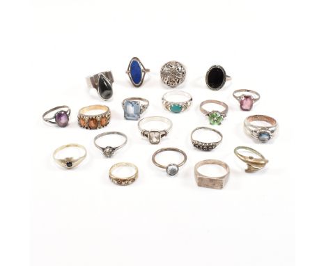 A collection of 19 silver and white metal rings. To include gem set including Lapis Lazuli, dolphin, paste, Mexican dome ring