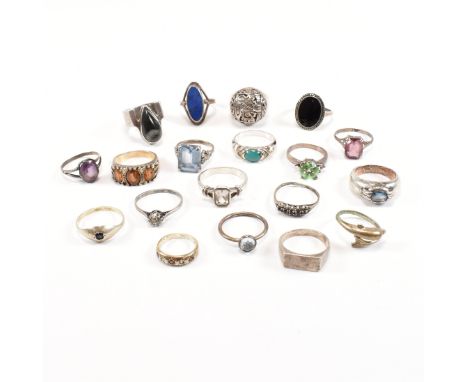 A collection of 19 silver and white metal rings. To include gem set including Lapis Lazuli, dolphin, paste, Mexican dome ring