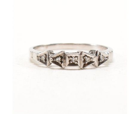 An Art Deco 18ct white gold and diamond ring. The ring having a head made from a single row of milgrain square and trapeze sh
