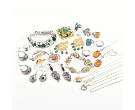 An assorted collection of silver and costume jewellery. The lot to include 750 18ct gold, hallmarked 925 silver, brooch pins,