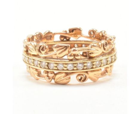 A hallmarked Clogau Tree of Life 18ct yellow gold and diamond eternity ring. The band ring having a central row of round cut 