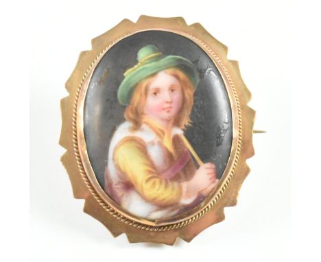 An antique 9ct gold and ceramic portrait brooch pin. The brooch having an oval ceramic panel to the centre depicting a young 